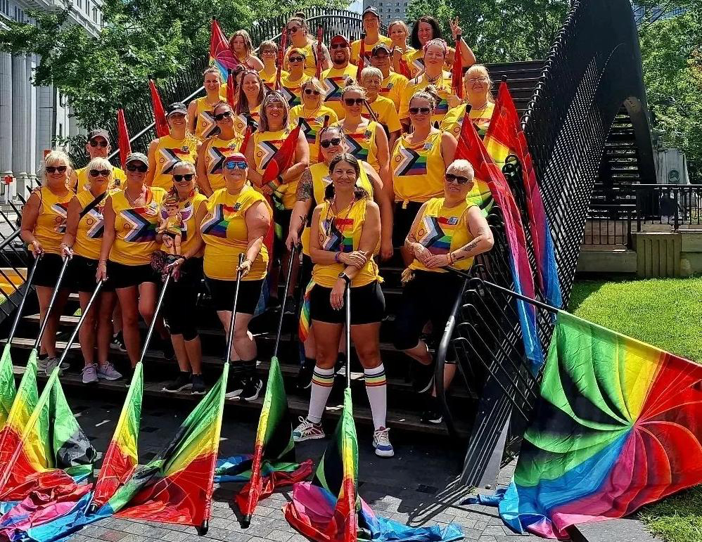 Group of SOTA members standing on a bridge